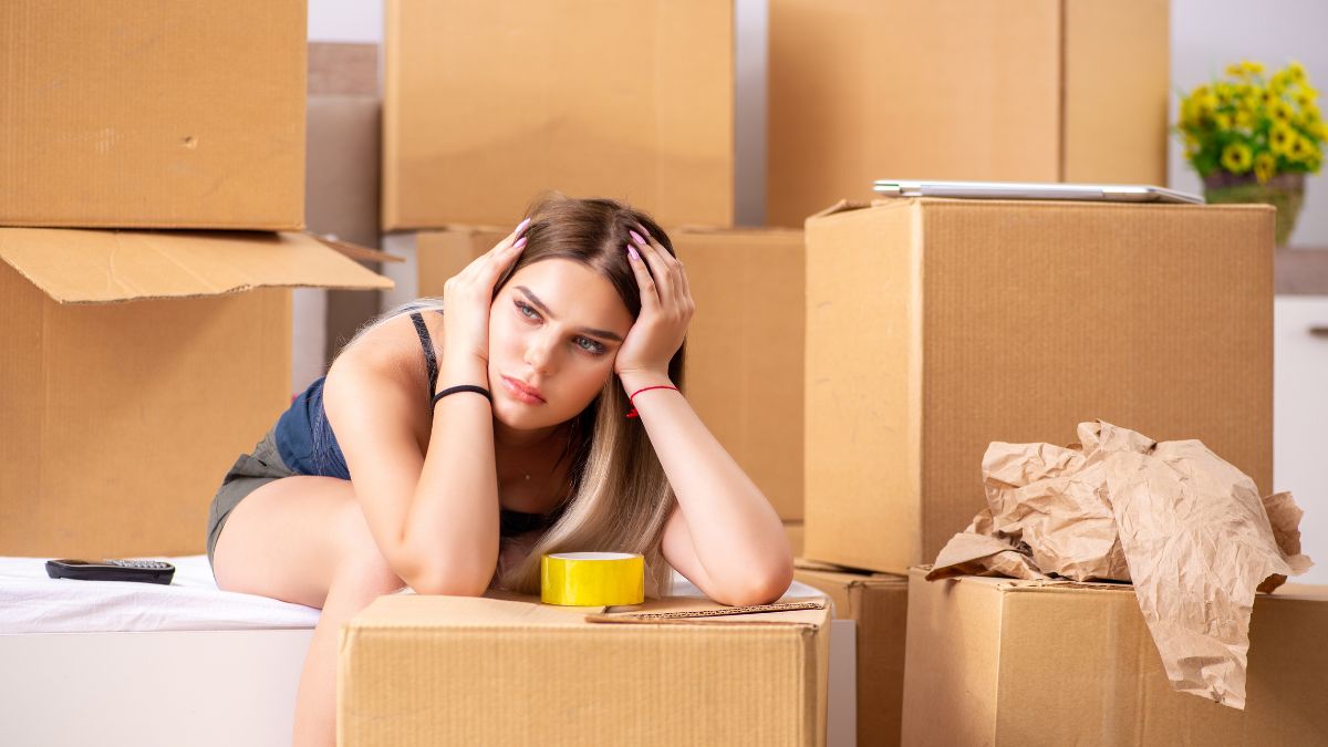 Woman Surrounded by moving boxes