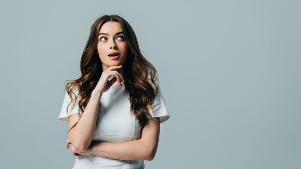 woman thinking and looking surprised