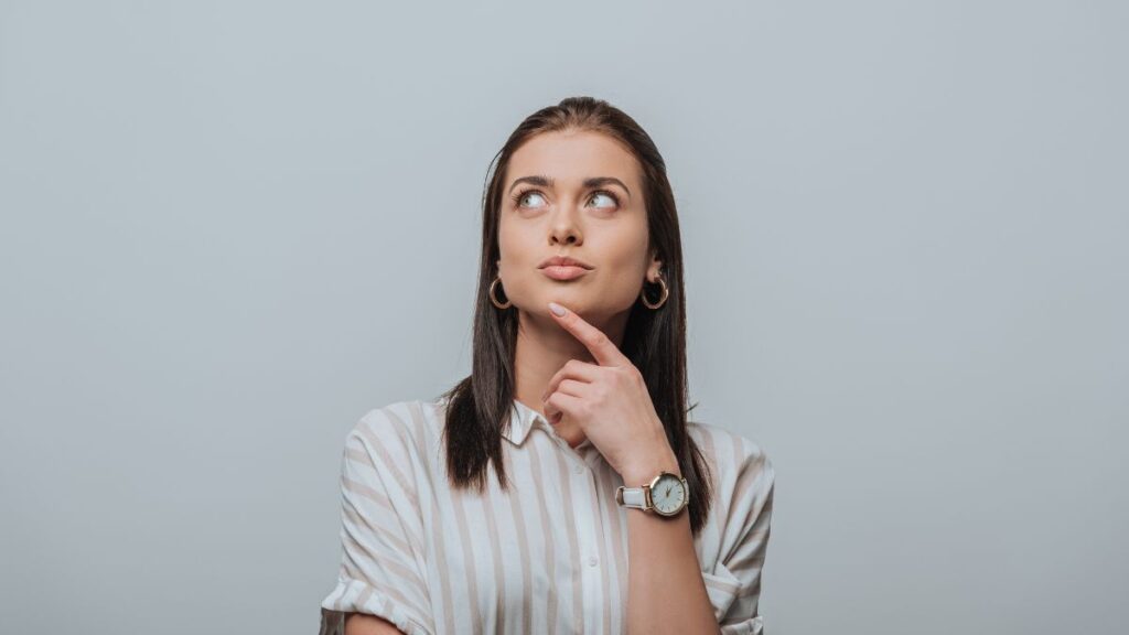 Woman thinking and looking up