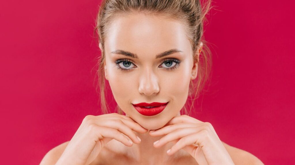 woman with red lips smiling