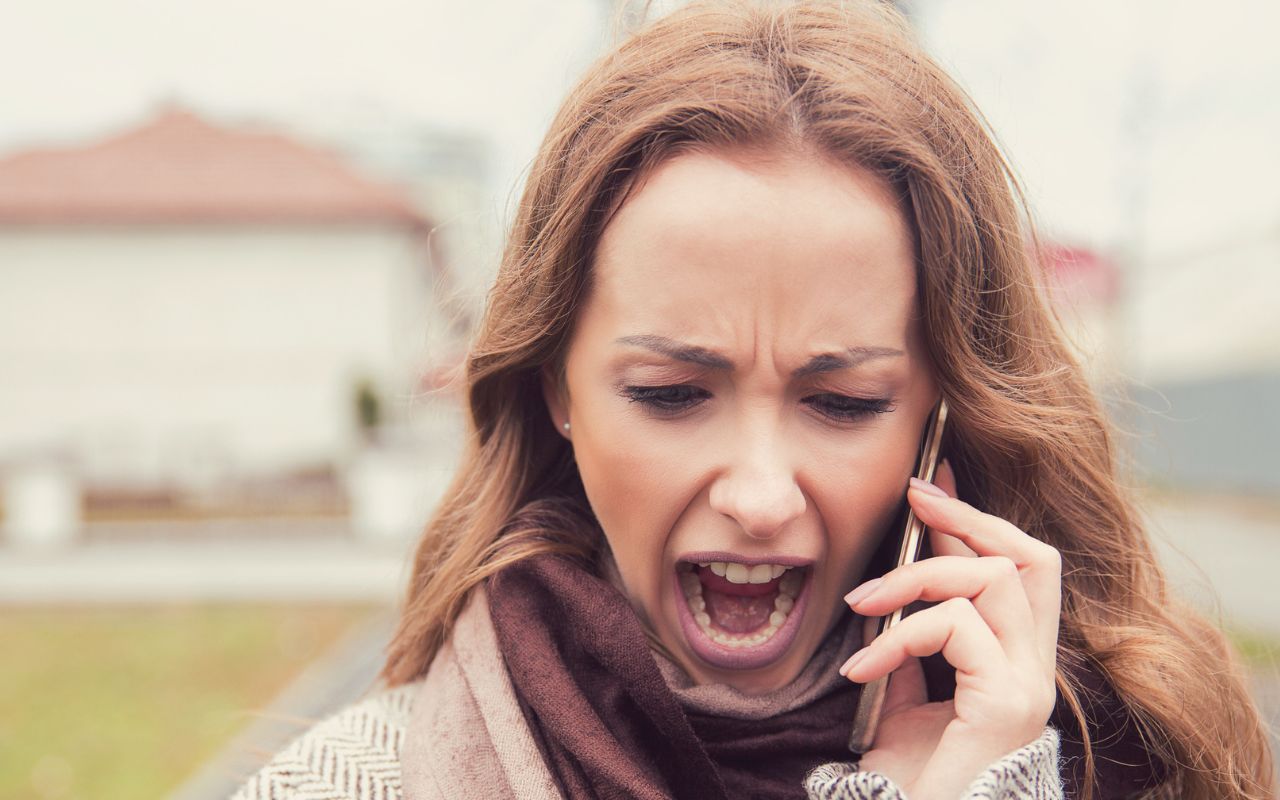 woman yelling into her phone