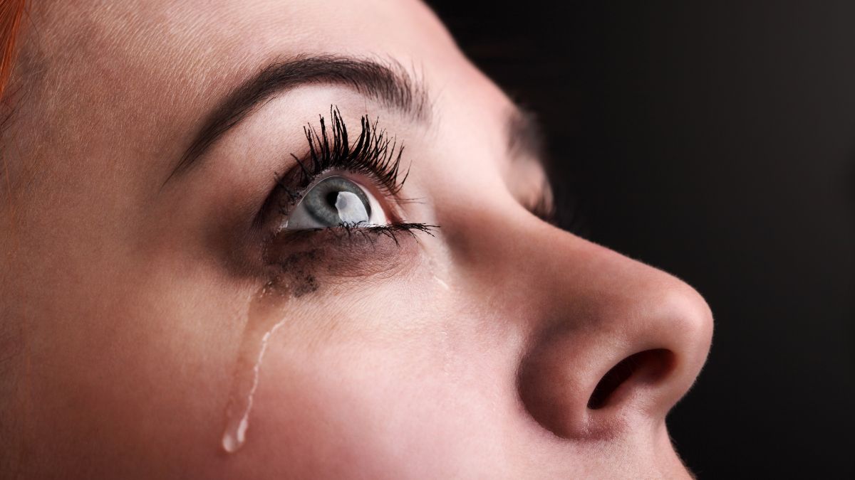 Woman's eye with a tear coming down