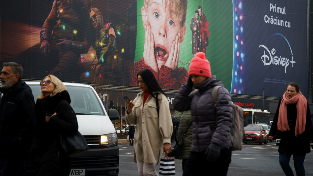 Home alone poster on busy street 