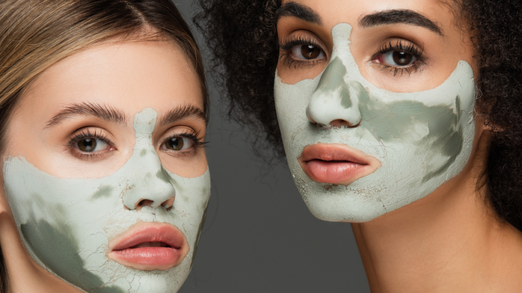 two women with clay face masks