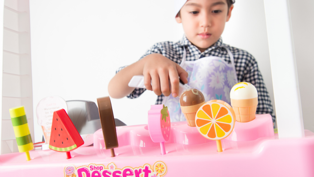 boy playing with pretend ice cream