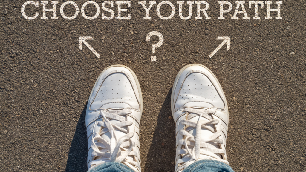 choose your path written on road with sneakers