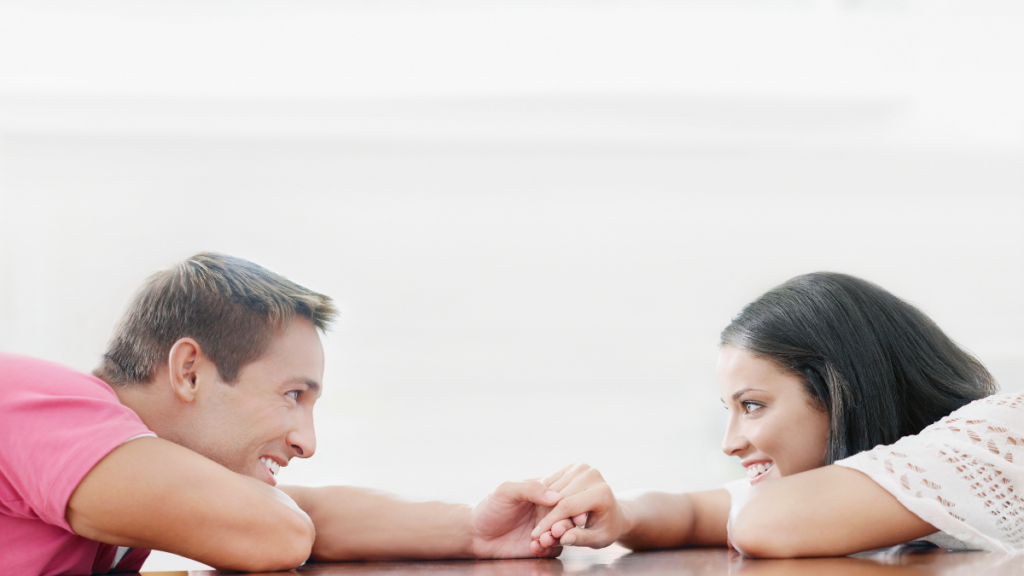 couple seperated by table