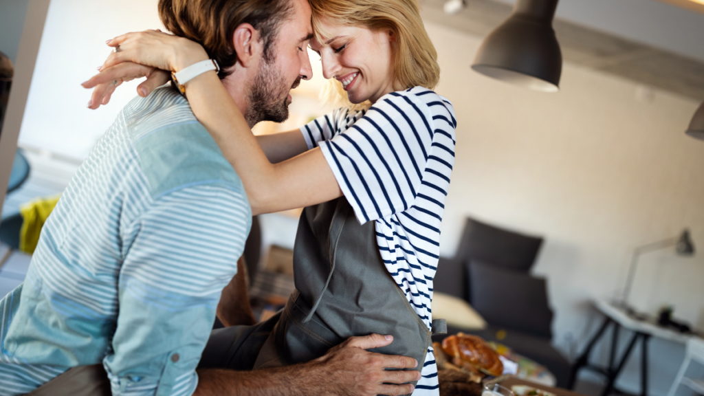 couple sitting on counter in clothes