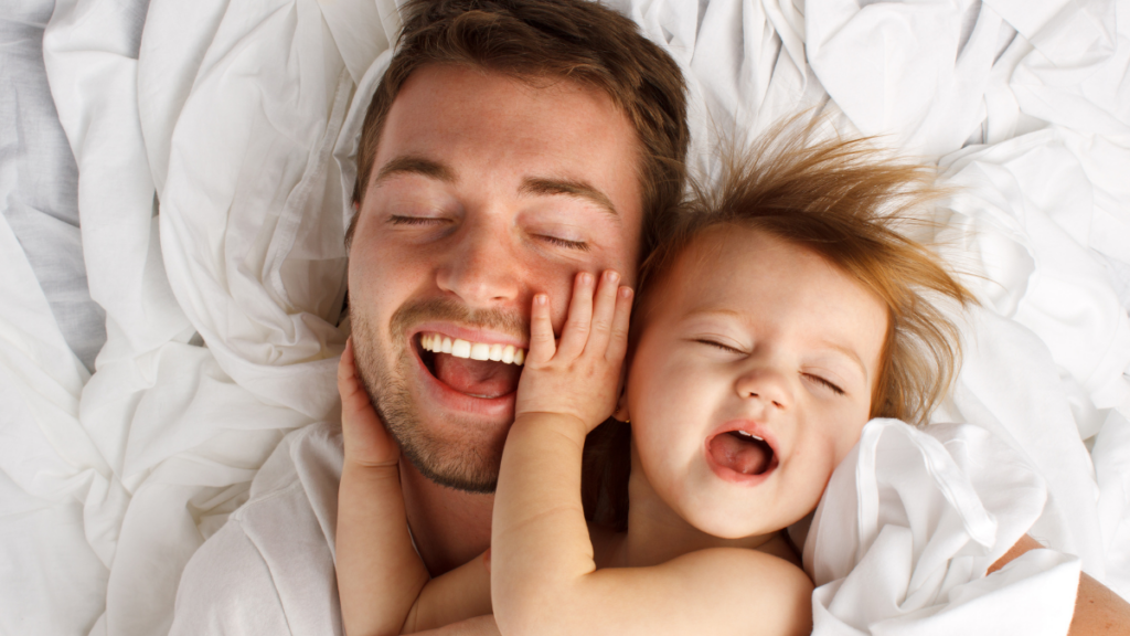 father and child in bed