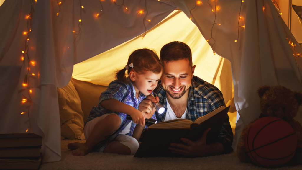 father reading with daughter 