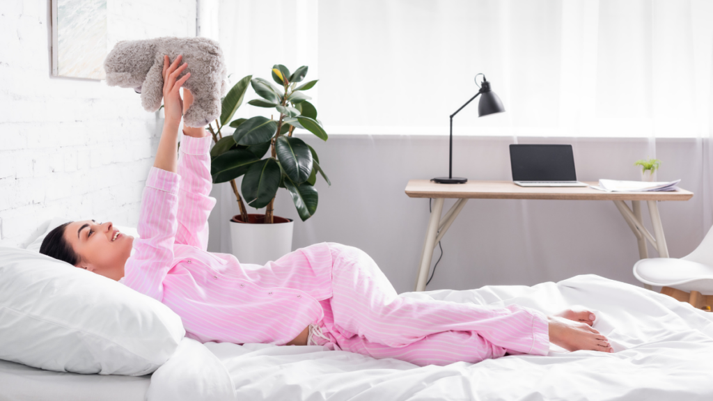 girl in pjs holding a bear