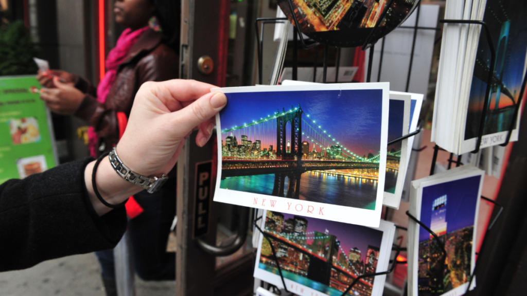 hand holding a postcard 