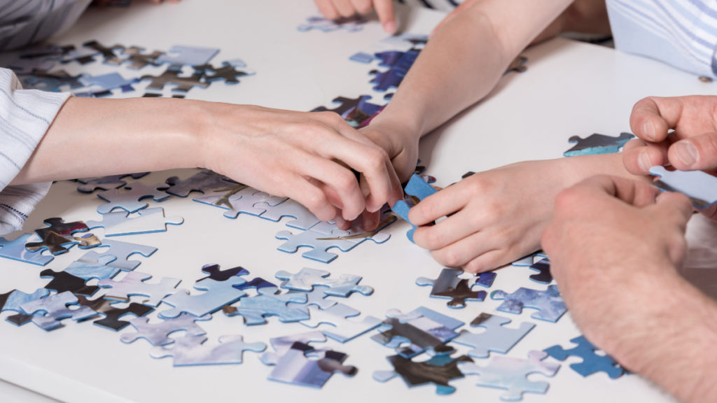 hands doing a puzzle