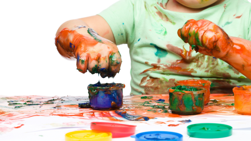 kid messy with paint