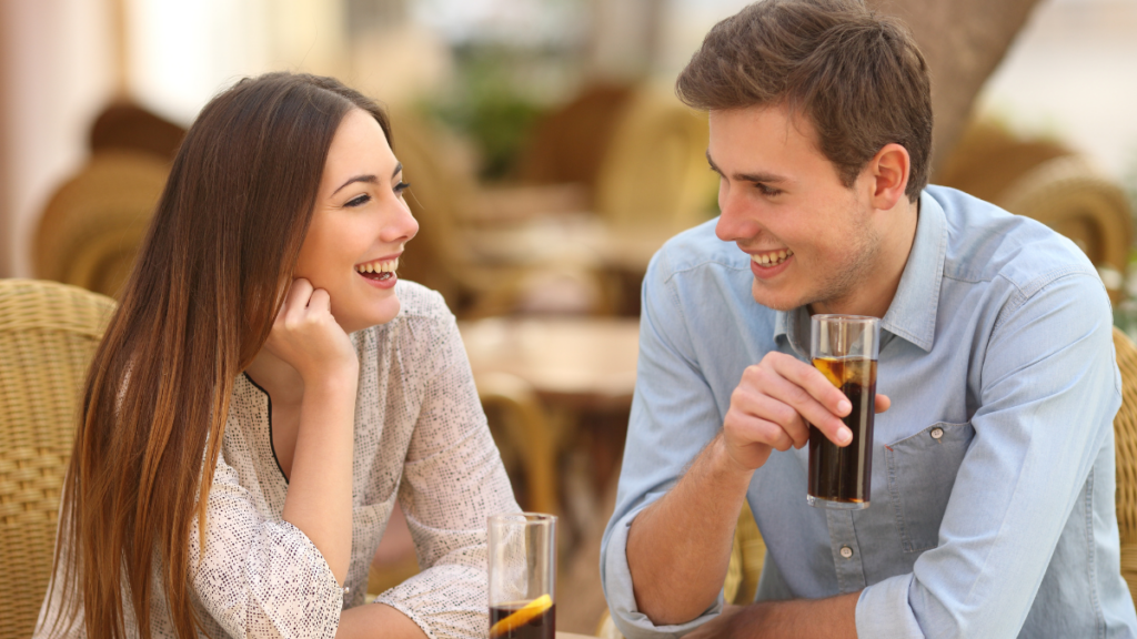 man and woman laughing and talking