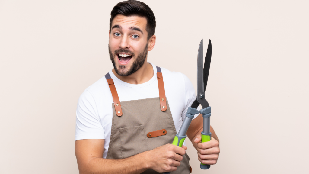 Man holding hedge trimmer