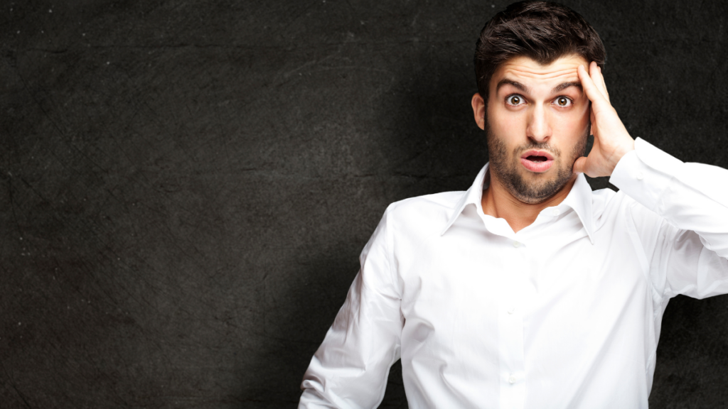 Man Looking Shocked wearing a white button down shirt