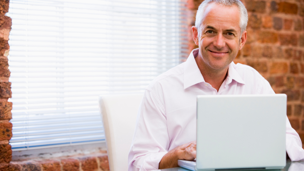 man sitting behind a computer