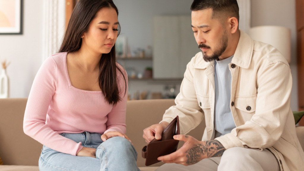 man with empty wallet showing woman