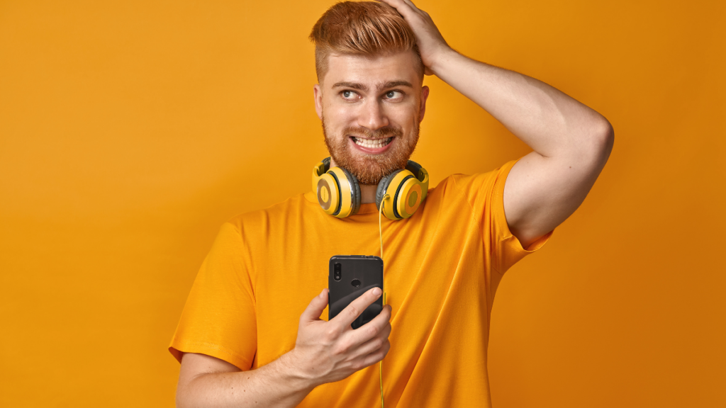 Man with headphones around his neck