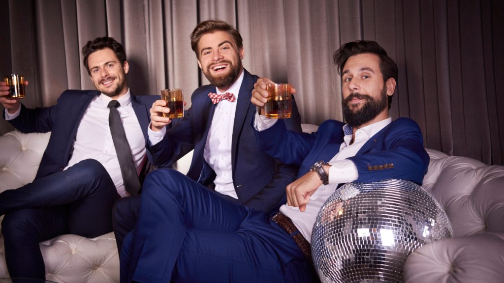 men drinking on couch