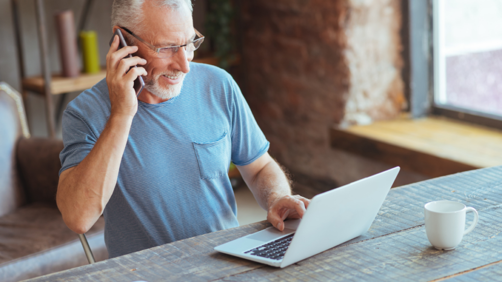 older man talking on phone