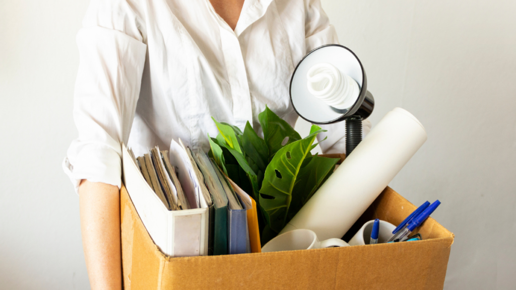 person holding box of stuff