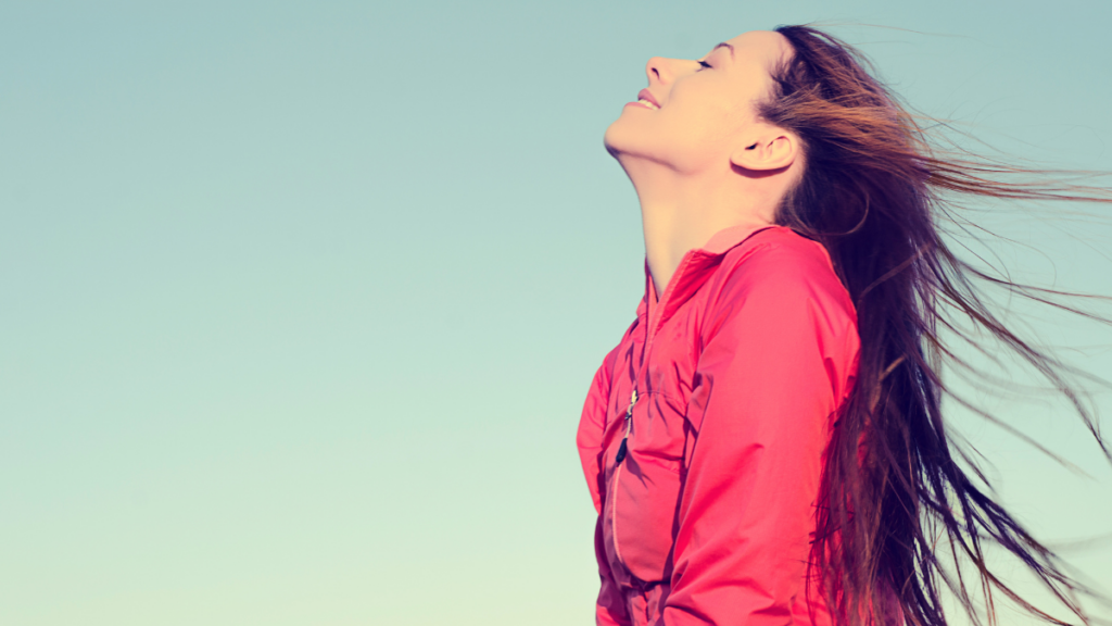 woman taking a breathe