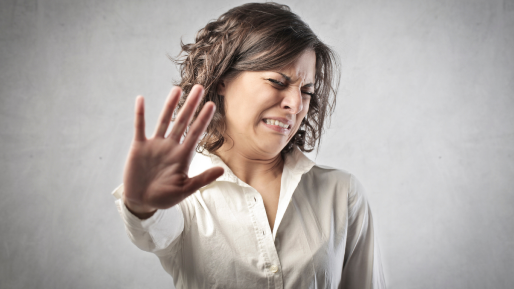 Woman disgusted looking away from camera