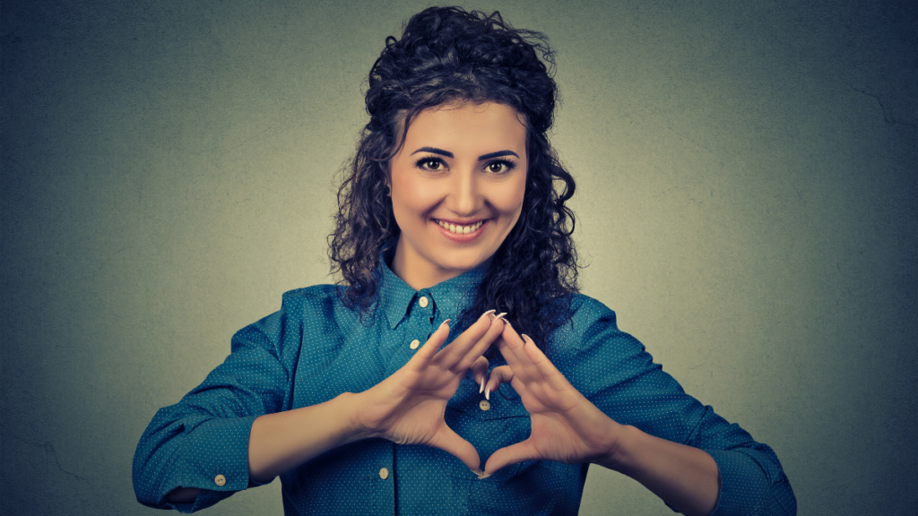 woman making a heart shape