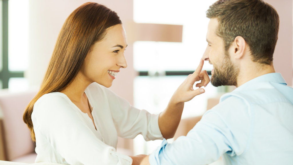 woman touching man's nose