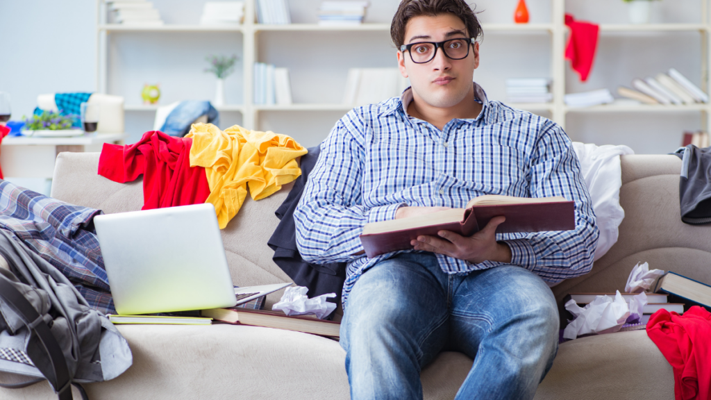 Young man working studying in messy room